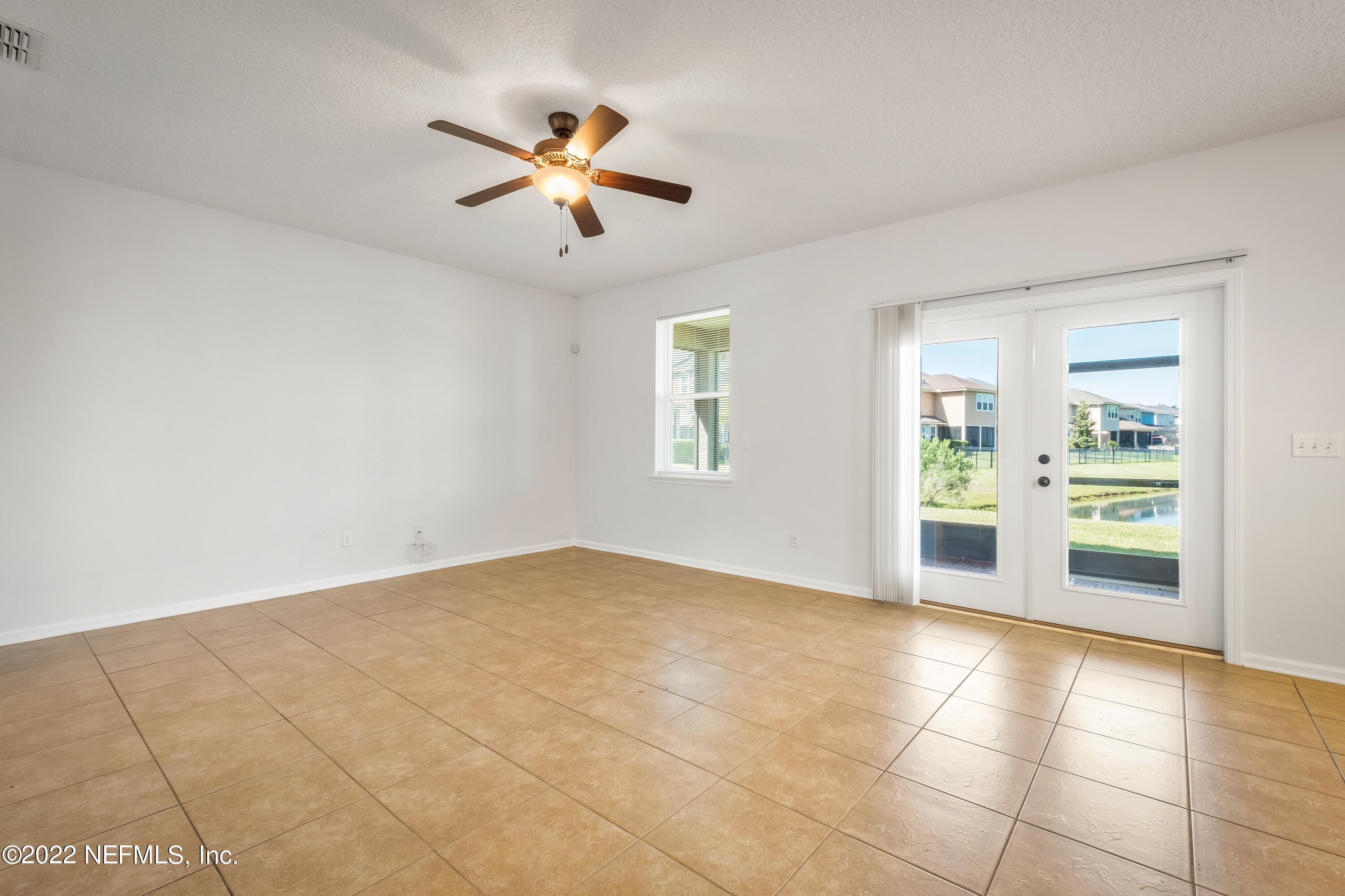 157 Heron Landing Road St. Johns, FL 32259 - Photo 9 of 40 a view of an empty room with a window