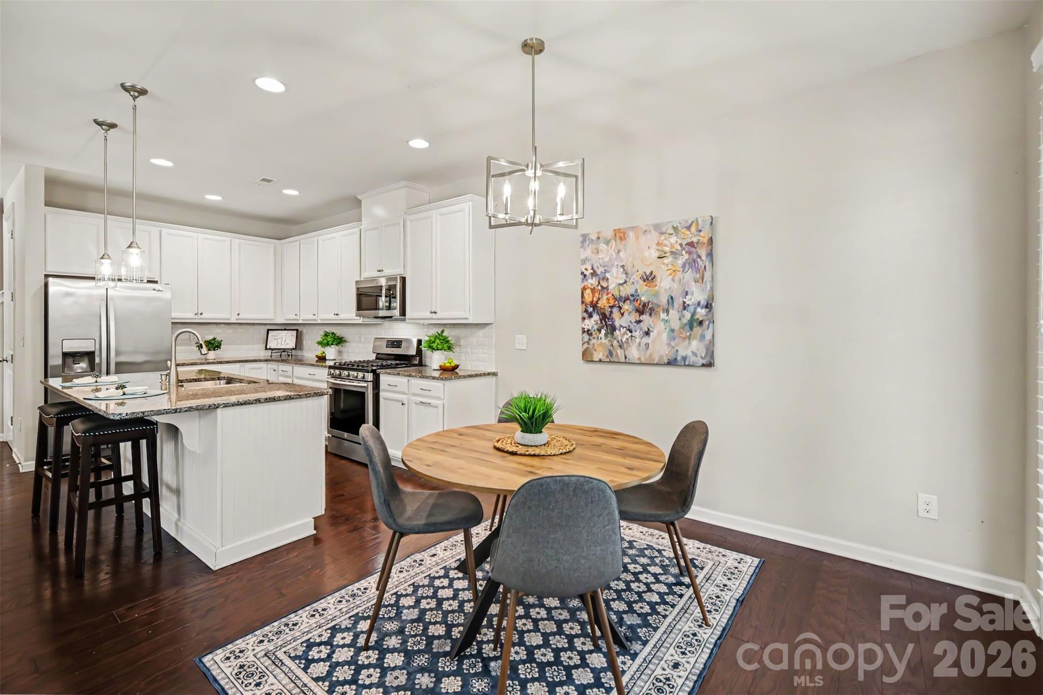 1029 Archibald Avenue Fort Mill, SC 29708 - Photo 13 of 45 a kitchen with a dining table and chairs