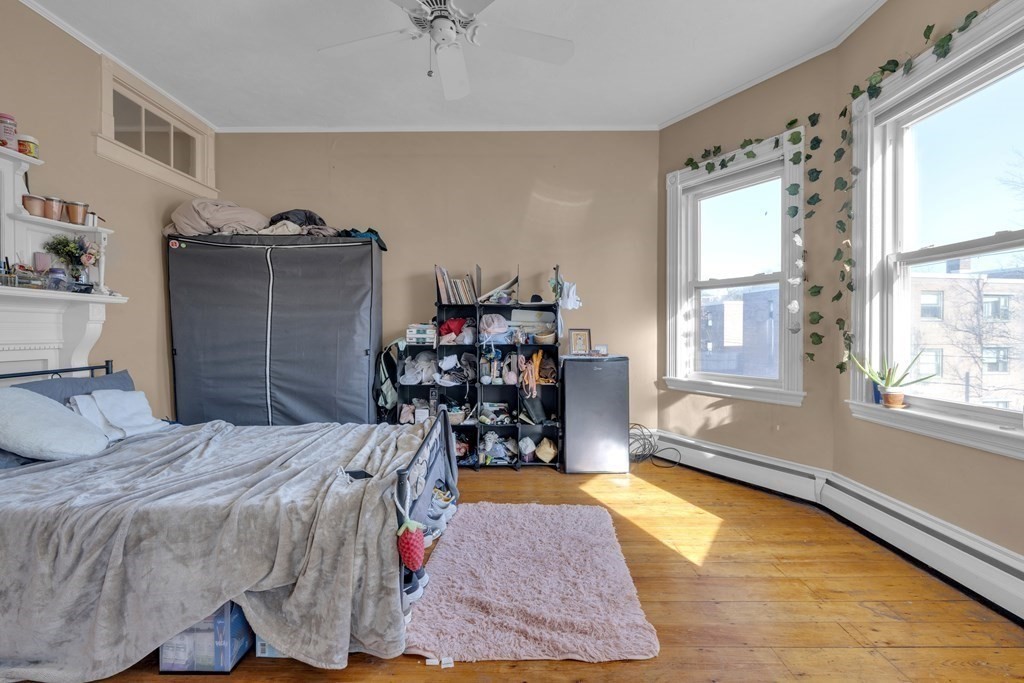 201 High Street, Unit 3 Brookline, MA 02445 - Photo 14 of 14 a bedroom with a bed and a window
