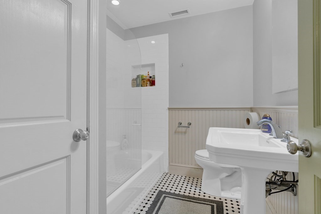 201 High Street, Unit 3 Brookline, MA 02445 - Photo 9 of 14 a bathroom with a sink toilet and shower