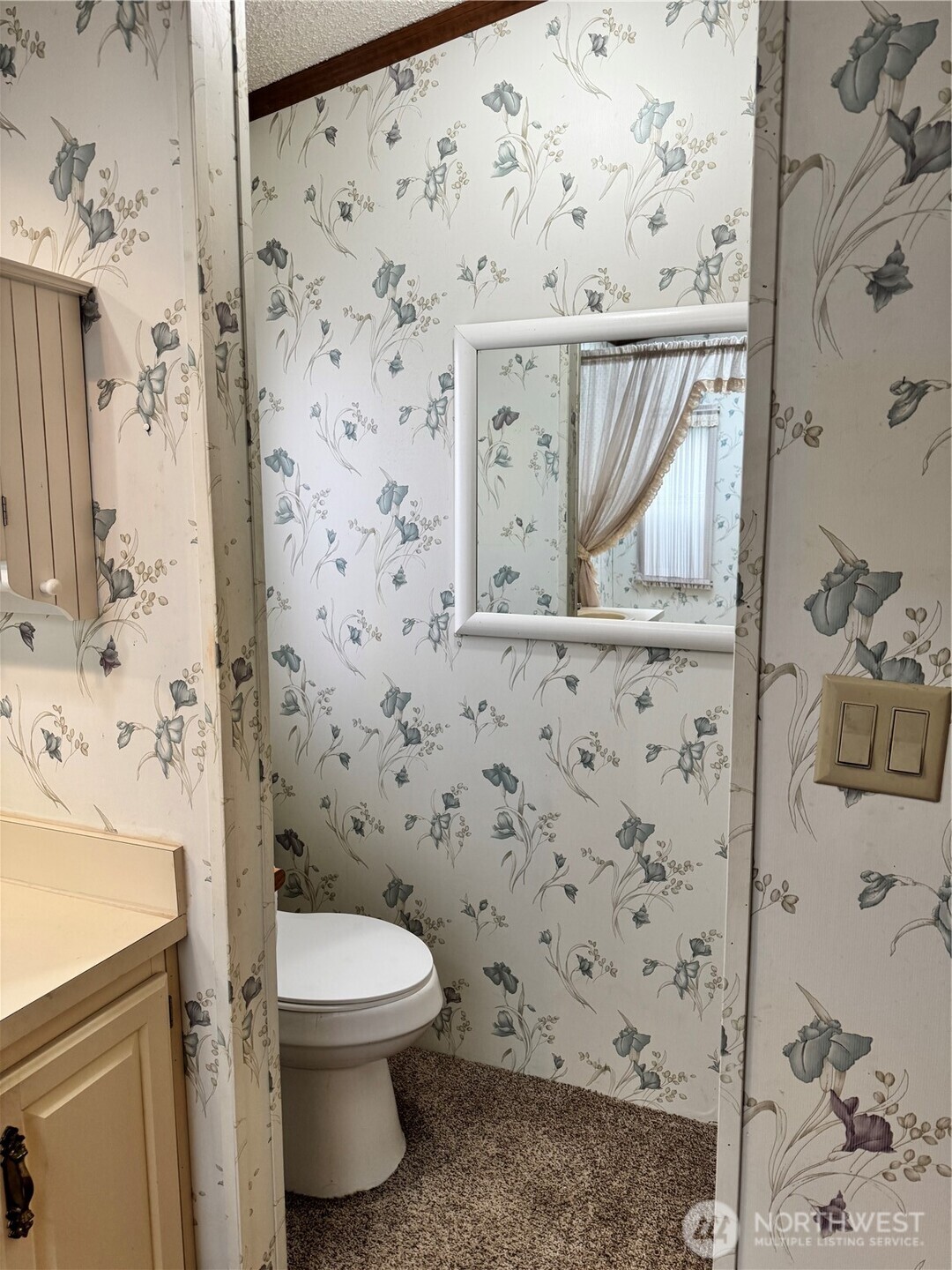 2388 Sparrow Loop, Unit 155 Kelso, WA 98626 - Photo 11 of 22 a bathroom with a toilet and a shower curtain