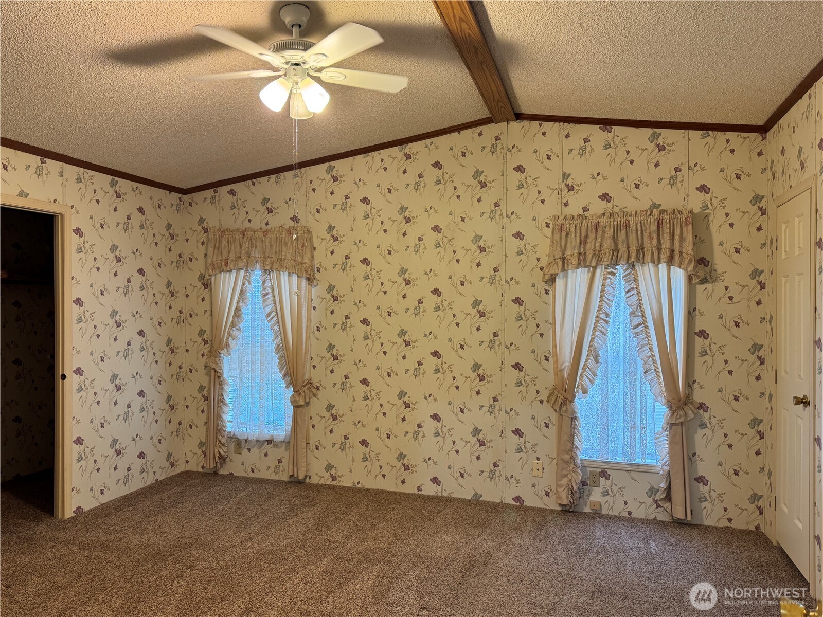 2388 Sparrow Loop, Unit 155 Kelso, WA 98626 - Photo 14 of 22 a view of a livingroom with a ceiling fan and a bathroom