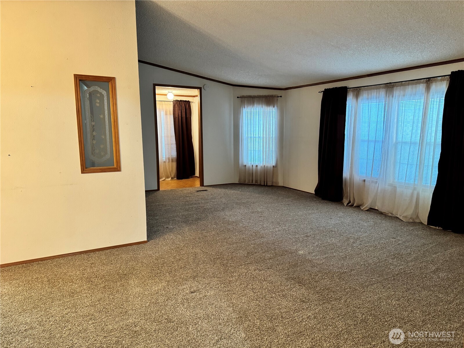2388 Sparrow Loop, Unit 155 Kelso, WA 98626 - Photo 17 of 22 an empty room with windows and closet