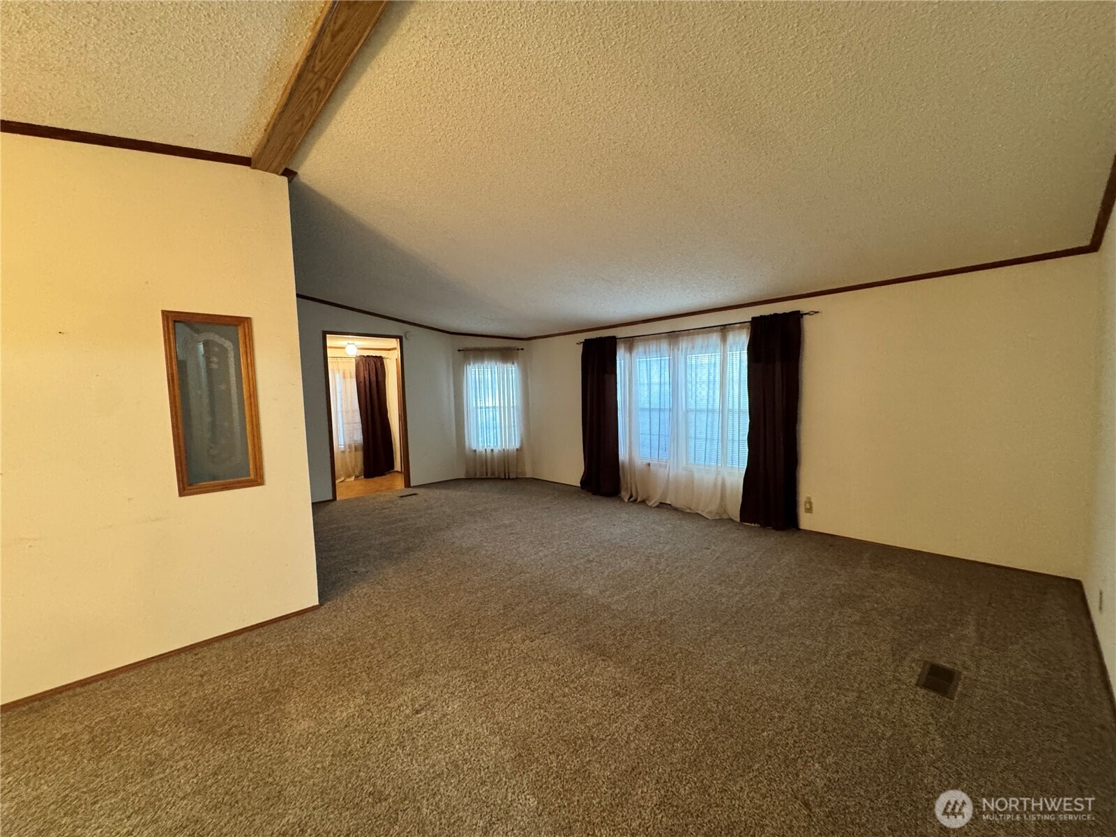 2388 Sparrow Loop, Unit 155 Kelso, WA 98626 - Photo 18 of 22 a view of an empty room with closet and a window