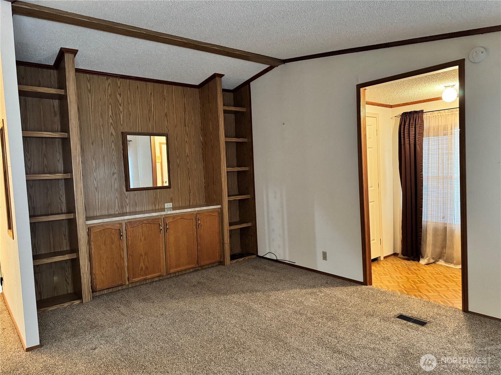 2388 Sparrow Loop, Unit 155 Kelso, WA 98626 - Photo 20 of 22 a view of an empty room with closet and a window