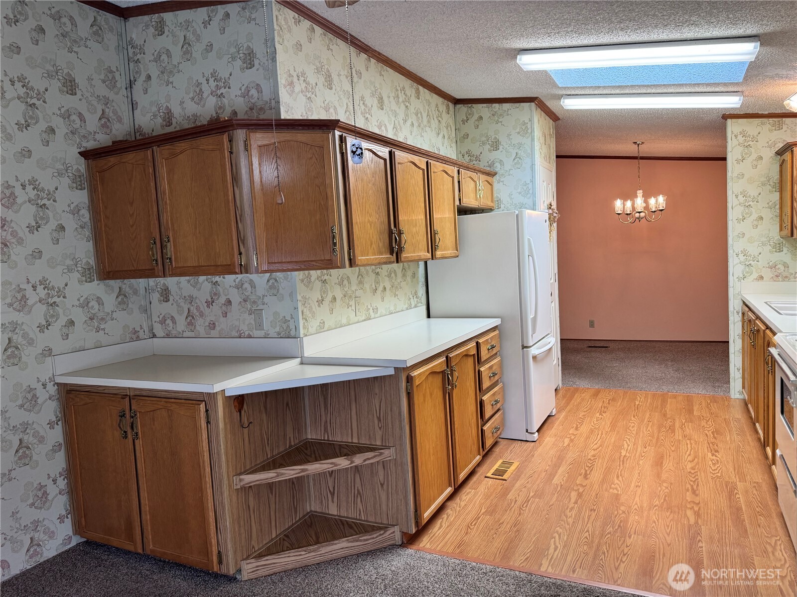 2388 Sparrow Loop, Unit 155 Kelso, WA 98626 - Photo 7 of 22 a kitchen with a sink and cabinets