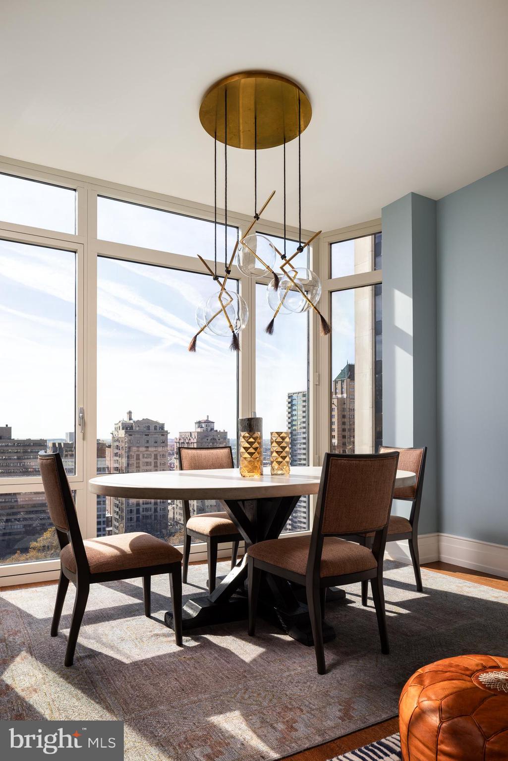 130 South 18th Street, Unit 1804 Philadelphia, PA 19103 - Photo 11 of 36 a view of a dining room with furniture window and wooden floor