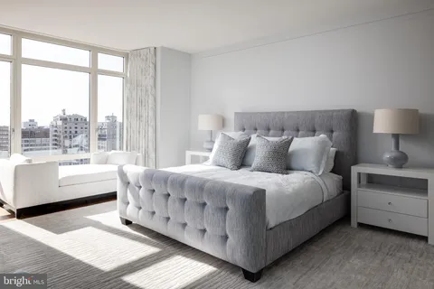 a bed room with a bed and a couch