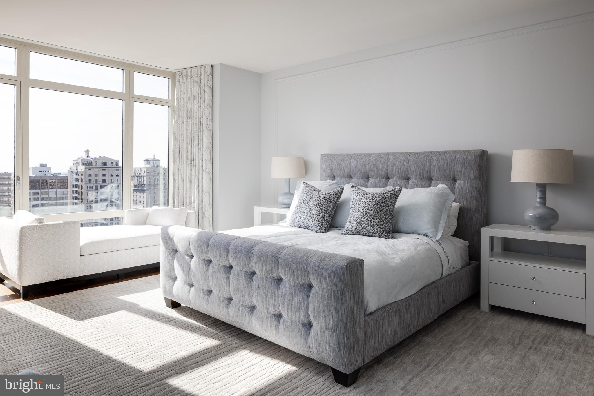 130 South 18th Street, Unit 1804 Philadelphia, PA 19103 - Photo 13 of 36 a bed room with a bed and a couch