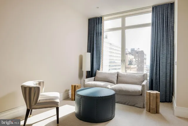 a living room with furniture and a window