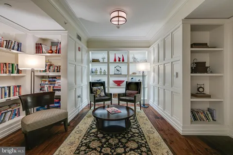a living room with furniture and a rug