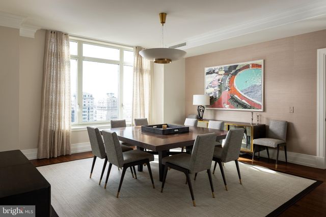 a view of a dining room with furniture window and wooden floor