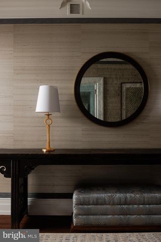 a living room with furniture and a lamp