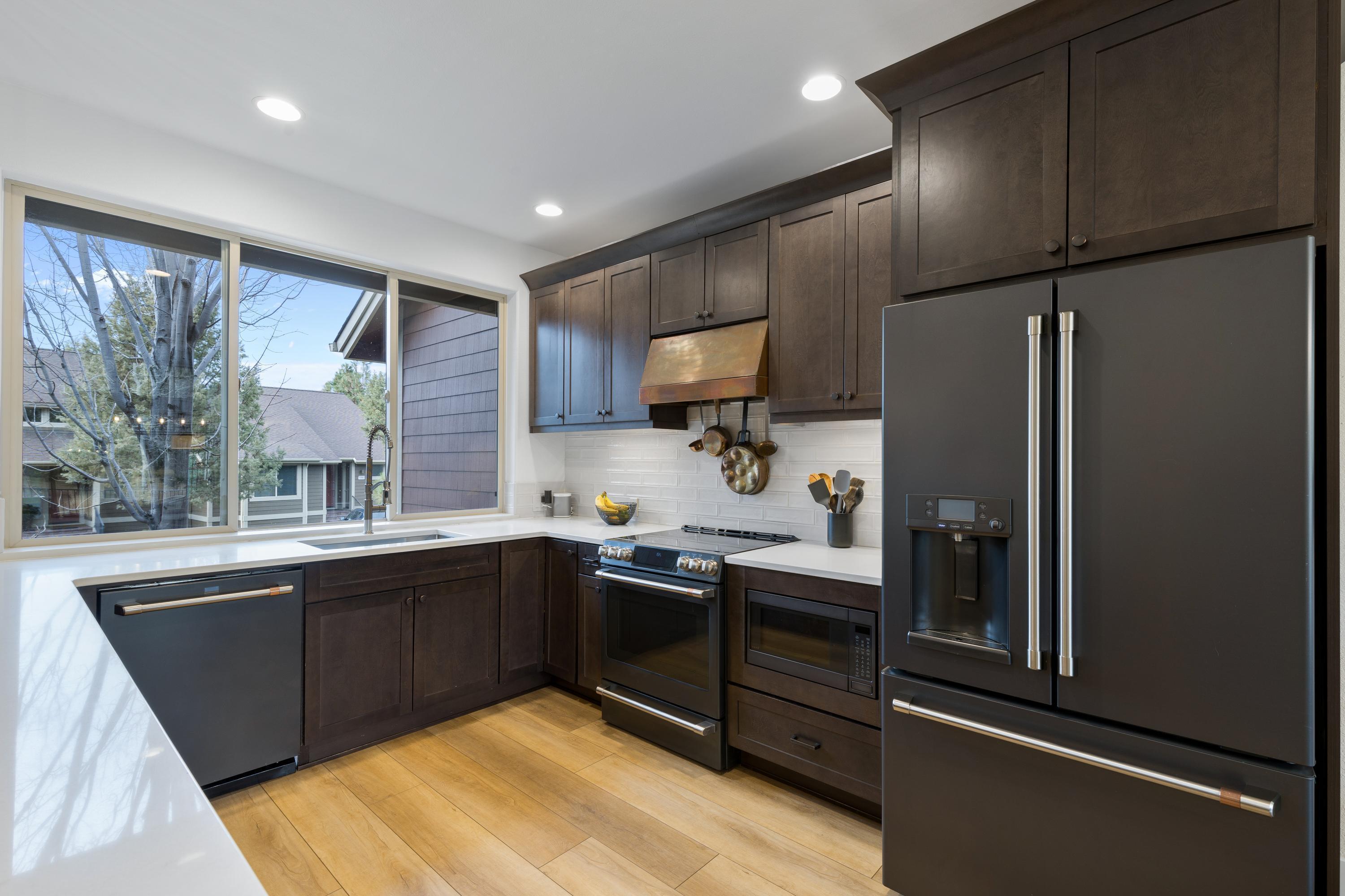 1281 Highland View Loop Redmond, OR 97756 - Photo 4 of 42 Enjoy new high-end appliances and a gorgeous custom copper range hood.
