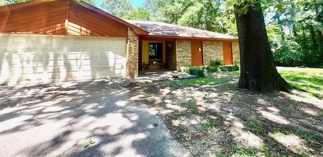 a view of a brick house with a large windows