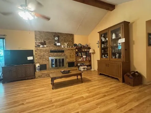 a living room with furniture and flat screen tv