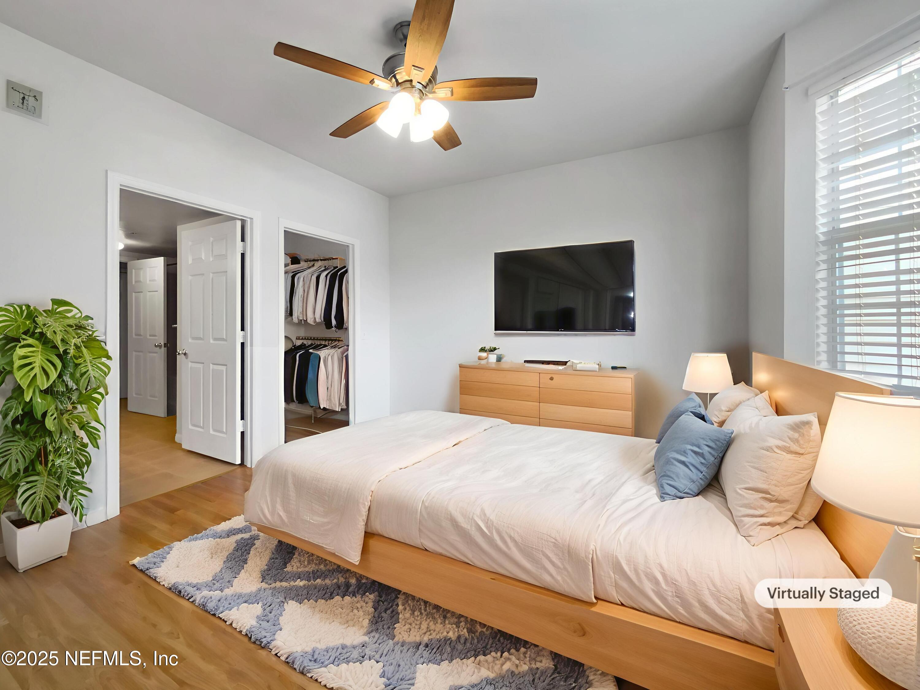 8550 Touchton Road, Unit 635 Jacksonville, FL 32216 - Photo 12 of 25 a bedroom with a large bed and a television