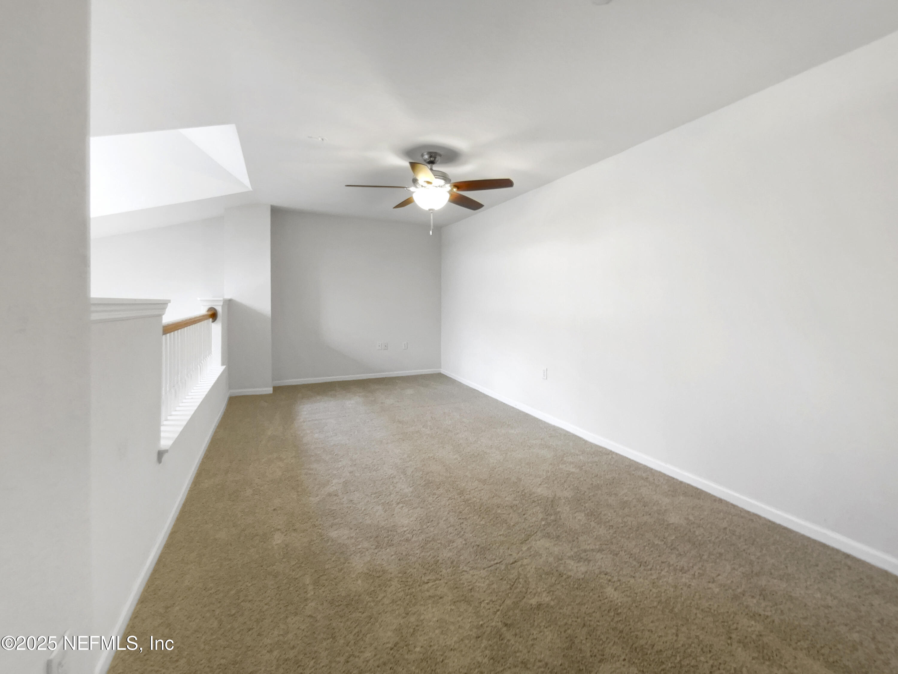 8550 Touchton Road, Unit 635 Jacksonville, FL 32216 - Photo 16 of 25 wooden floor in an empty room with a window