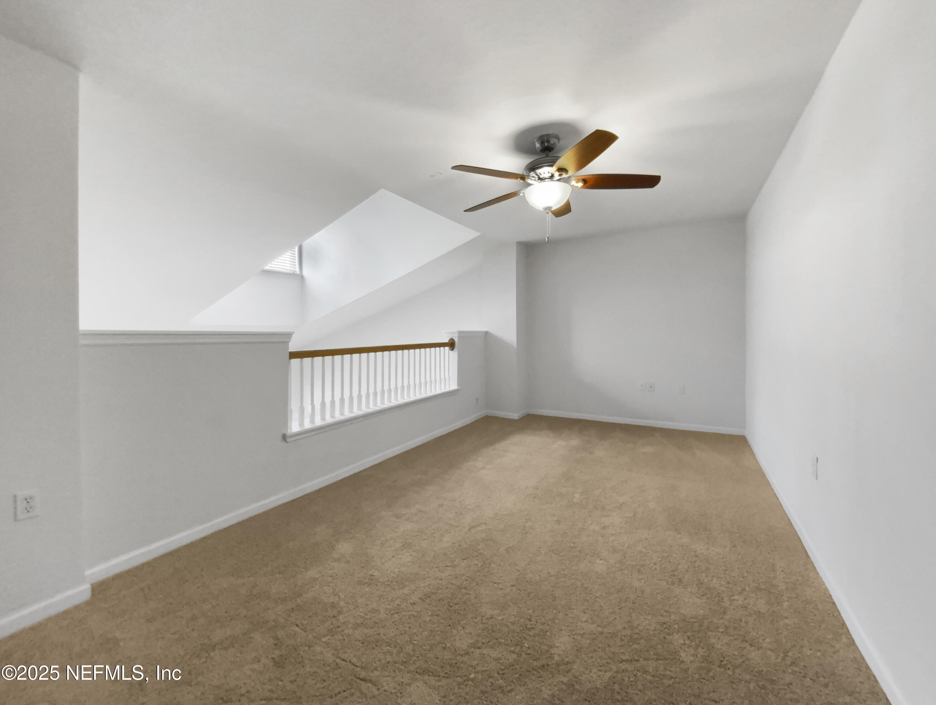 8550 Touchton Road, Unit 635 Jacksonville, FL 32216 - Photo 17 of 25 an empty room with a window and a ceiling fan
