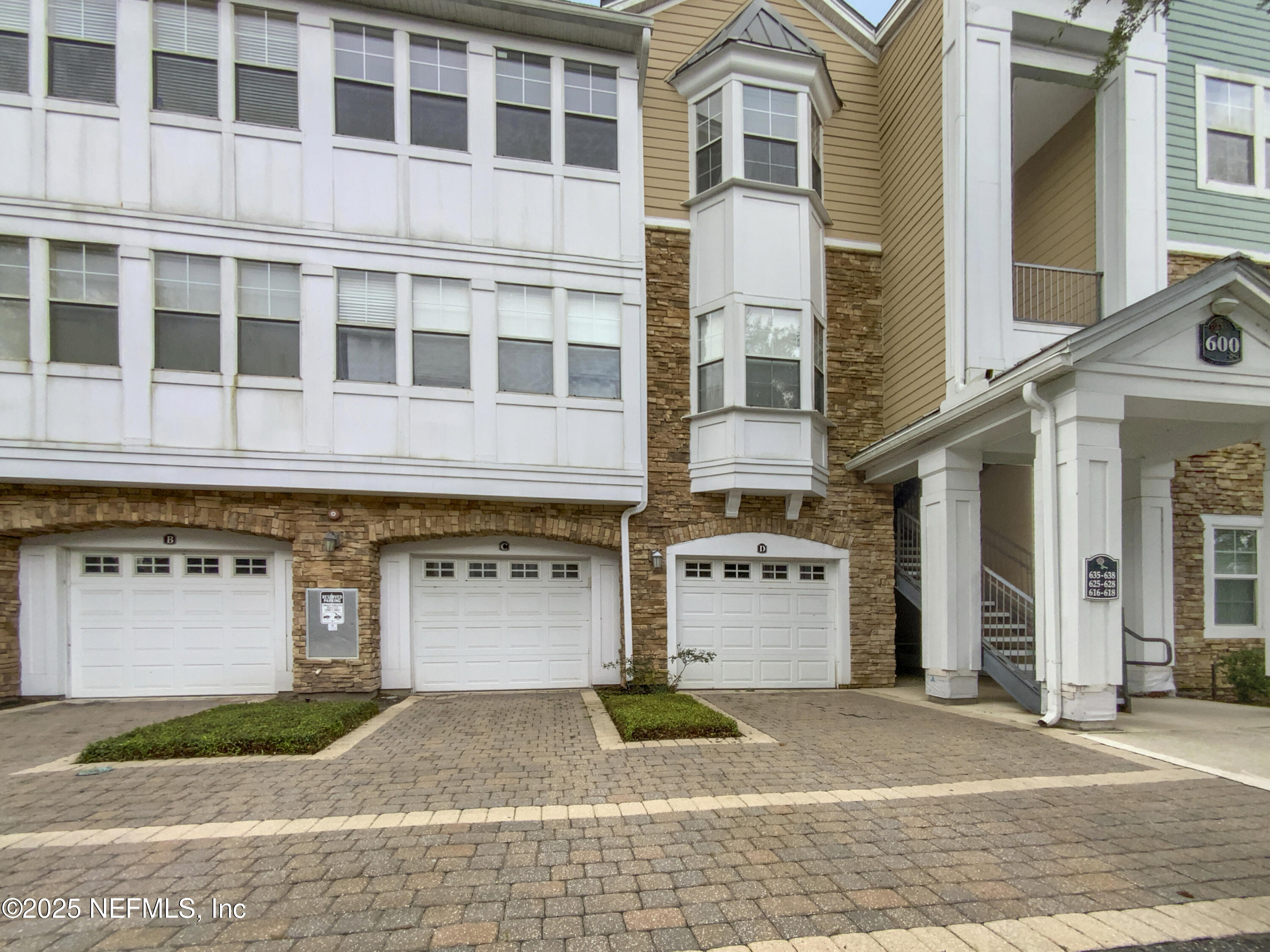 8550 Touchton Road, Unit 635 Jacksonville, FL 32216 - Photo 2 of 25 a front view of a building with a garden and parking