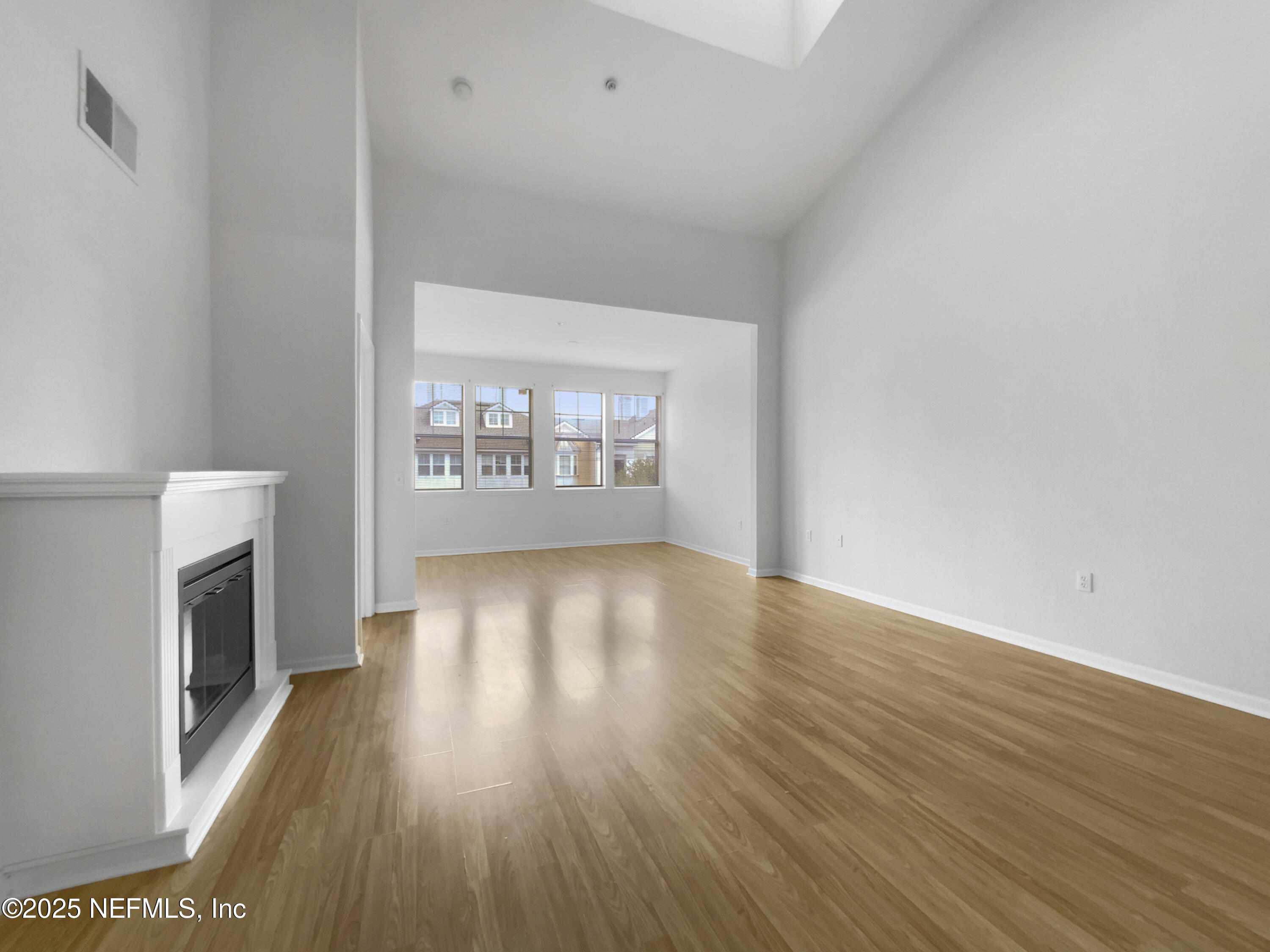 8550 Touchton Road, Unit 635 Jacksonville, FL 32216 - Photo 5 of 25 wooden floor in an empty room with a window