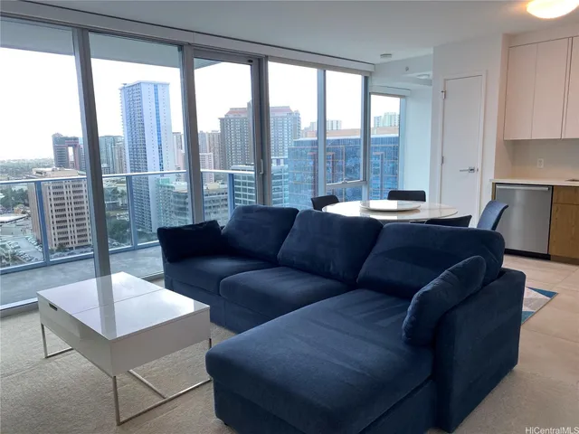 a living room with furniture and a large window