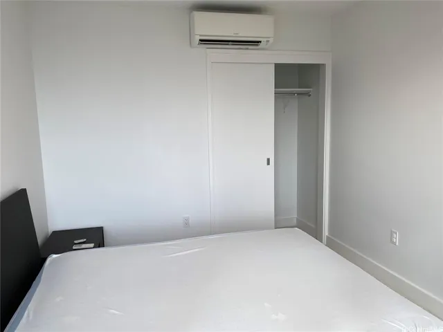 a bathroom with a sink shower and a mirror