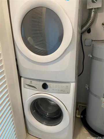 a view of swimming pool with chairs in front of door