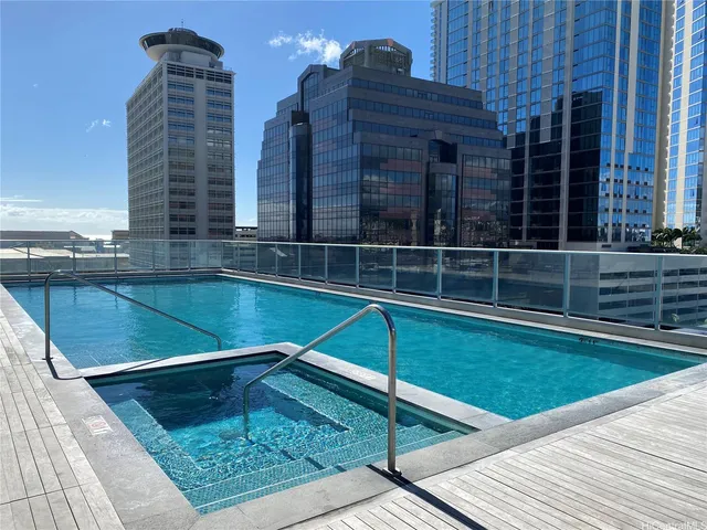a view of a patio with couches table and chairs and potted plants