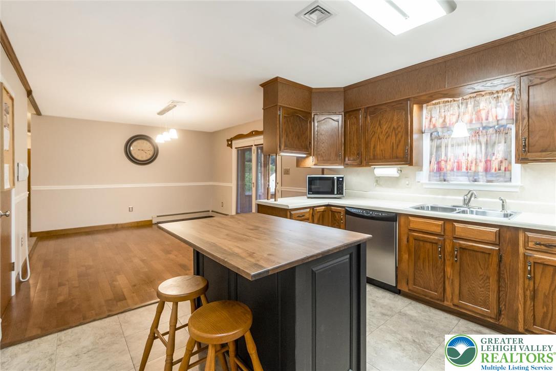 1053 Hilltop Road Leesport, PA 19533 - Photo 11 of 46 a kitchen with a sink cabinets and window