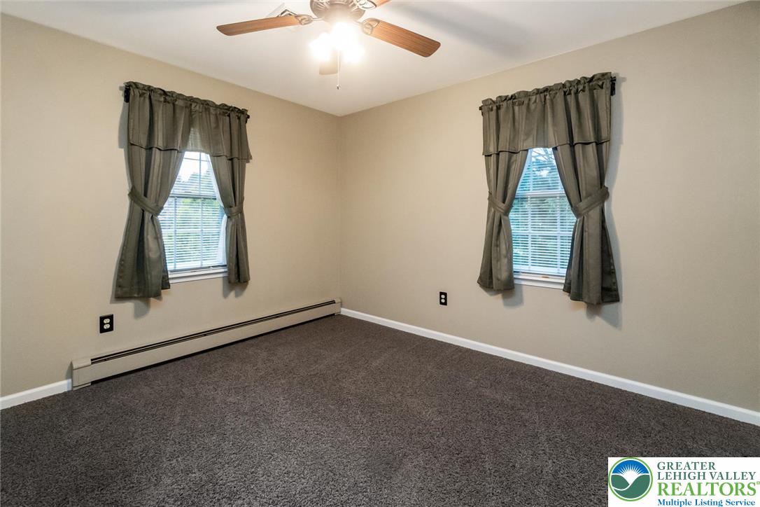 1053 Hilltop Road Leesport, PA 19533 - Photo 24 of 46 an empty room with windows and closet