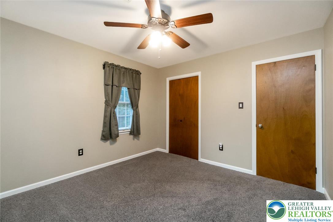 1053 Hilltop Road Leesport, PA 19533 - Photo 26 of 46 an empty room with windows and fan