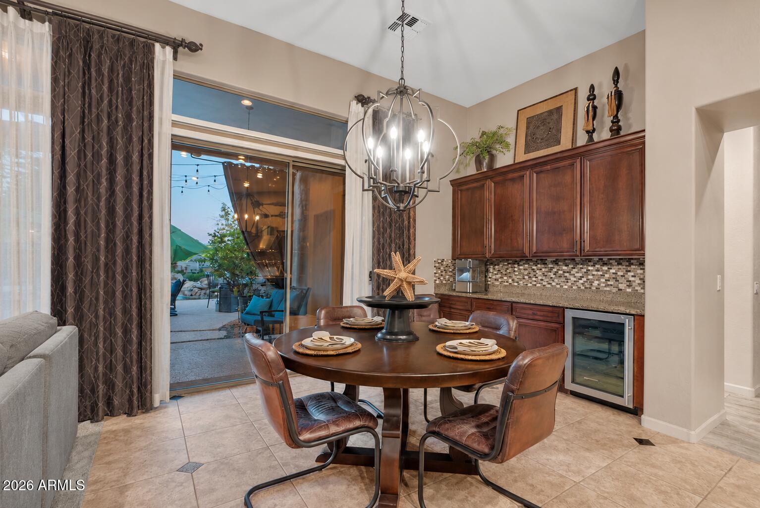 6427 South Magic Court Gilbert, AZ 85298 - Photo 25 of 71 a view of a dining room with furniture window and outside view