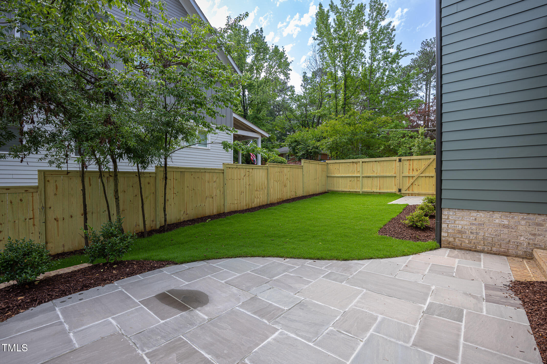 1000 Marilyn Drive Raleigh, NC 27607 - Photo 52 of 59 Flagstone patio just off screen porch.