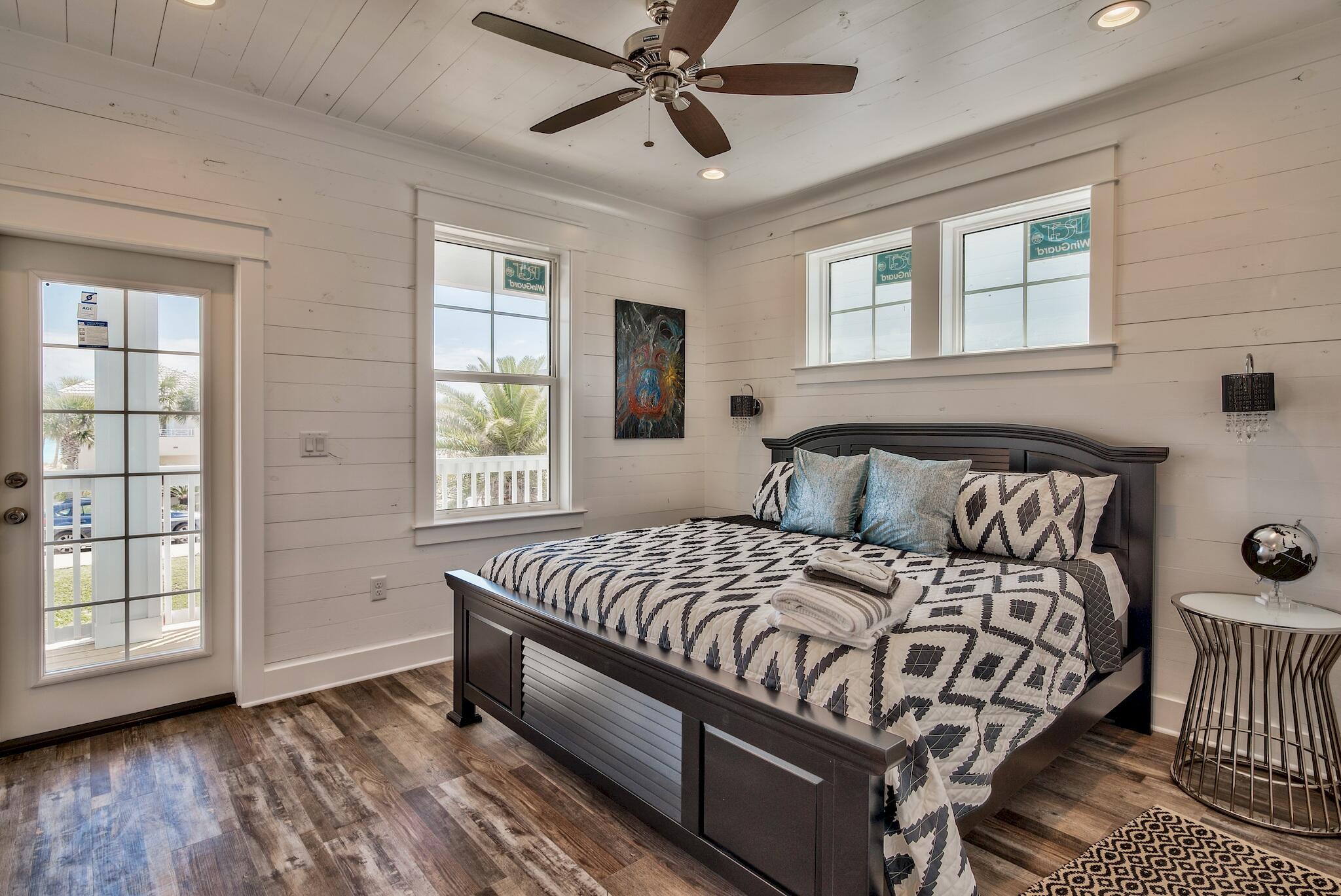 4488 Ocean View Drive Destin, FL 32541 - Photo 16 of 23 a bedroom with a bed and window