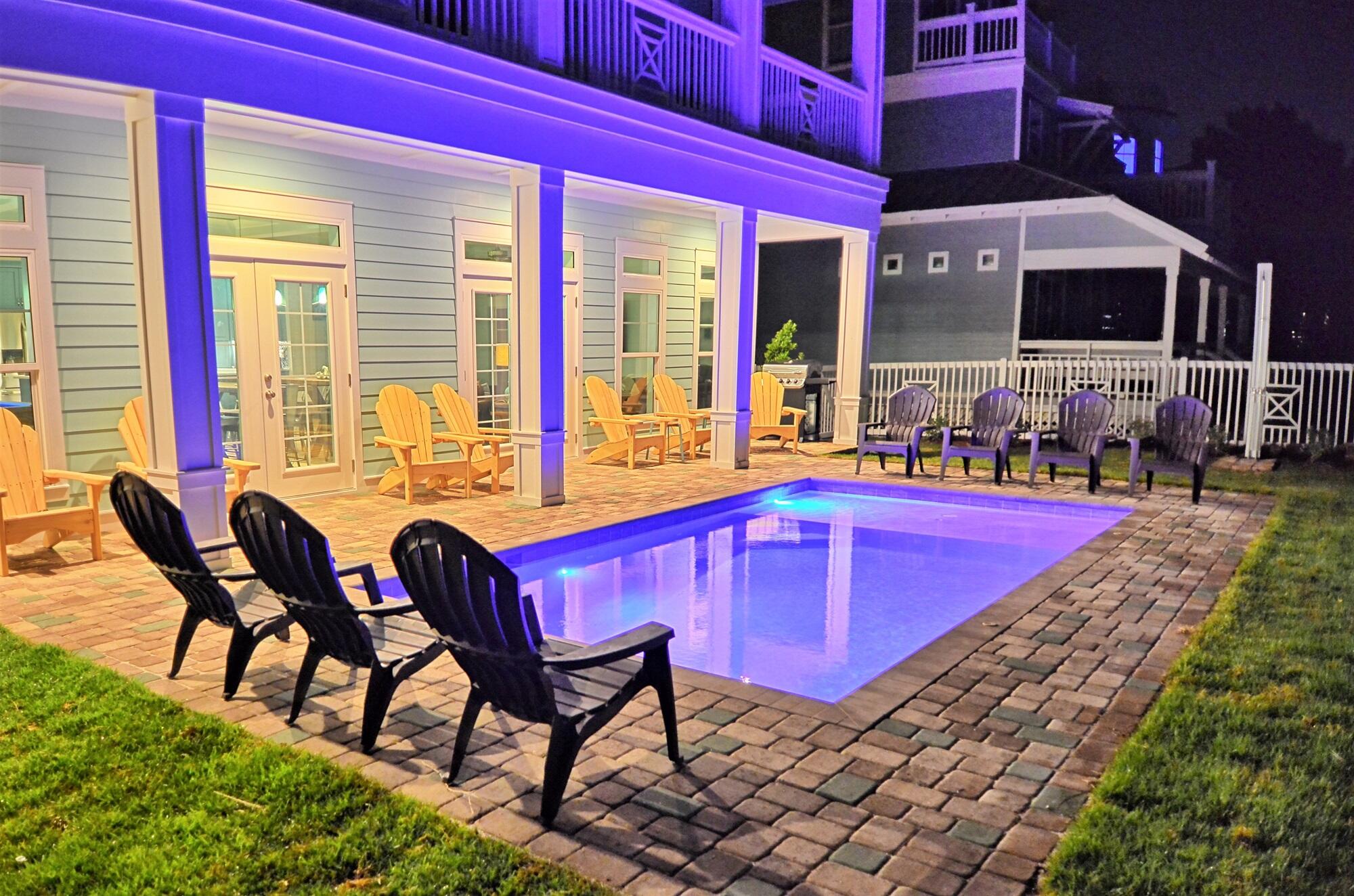 4488 Ocean View Drive Destin, FL 32541 - Photo 5 of 23 a view of a swimming pool with red chairs