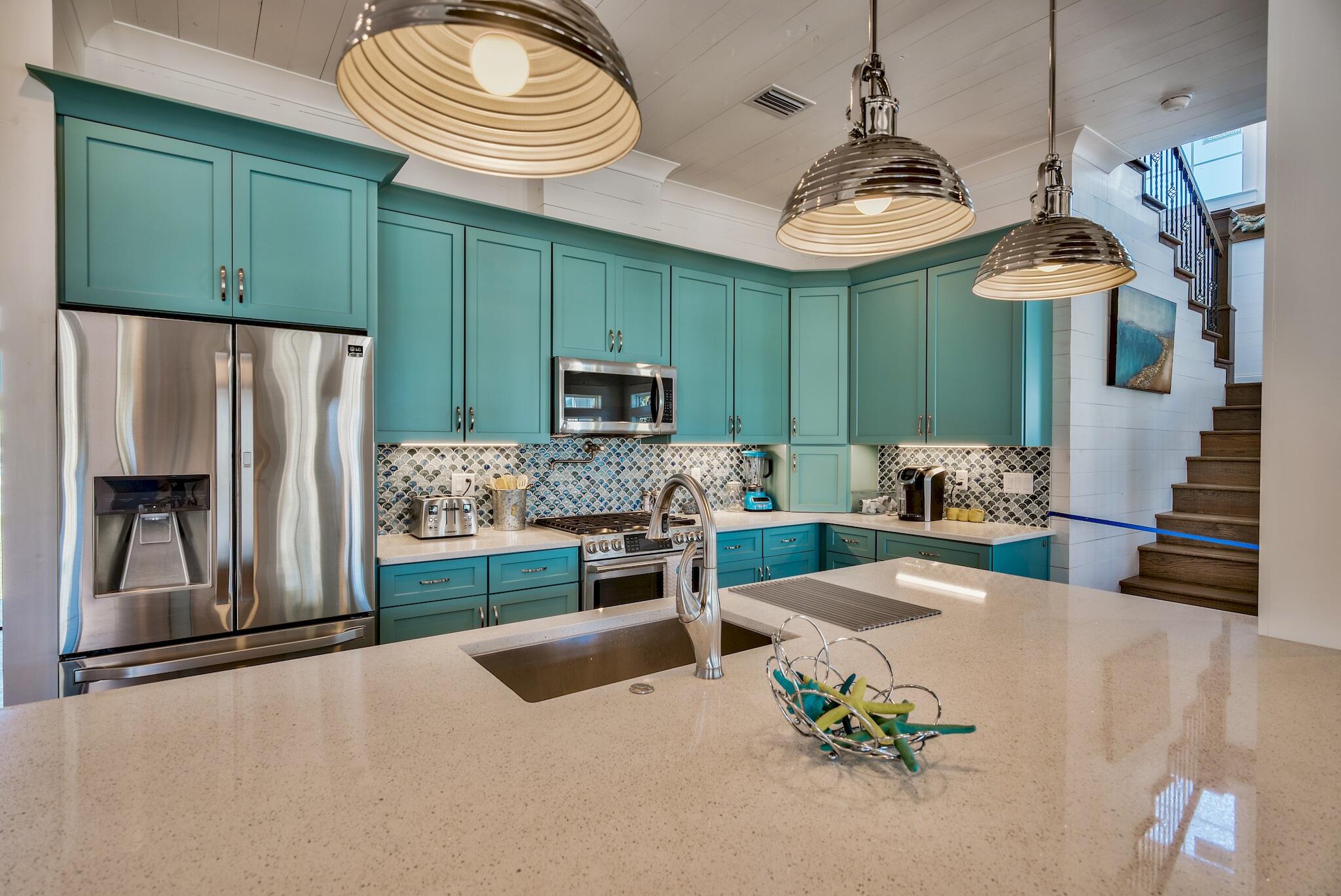4488 Ocean View Drive Destin, FL 32541 - Photo 8 of 23 a kitchen with stainless steel appliances granite countertop a sink and a refrigerator