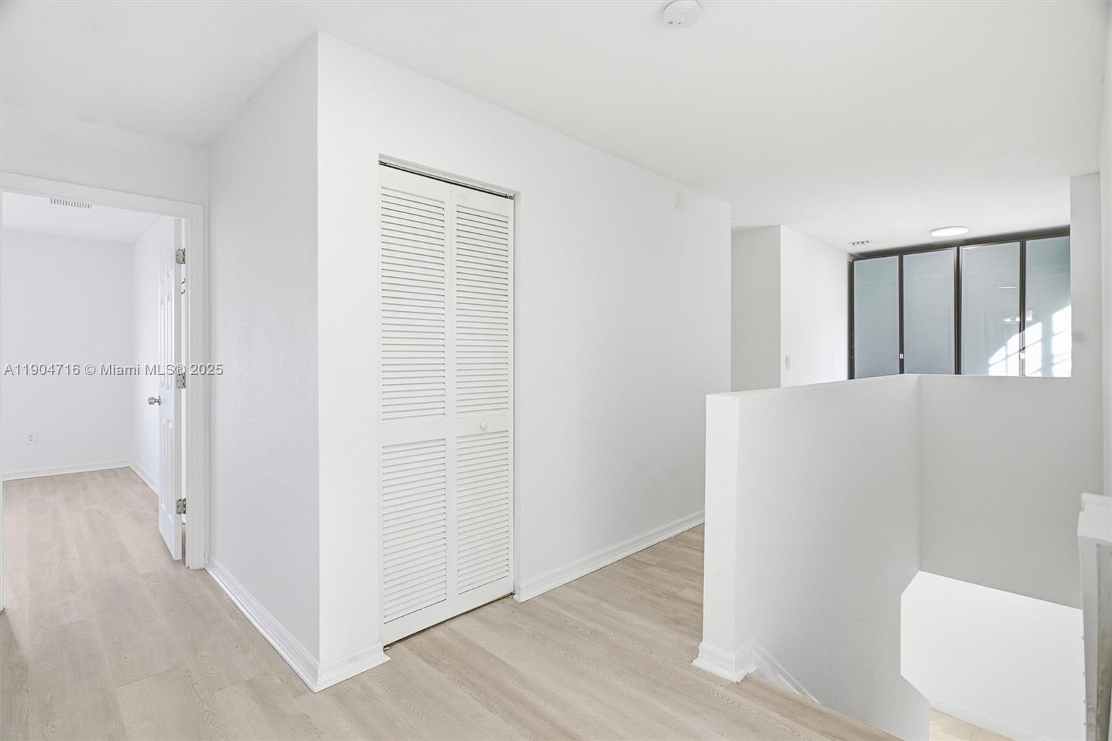 4628 Southwest 125th Lane Miramar, FL 33027 - Photo 18 of 44 a view of a room with wooden floor