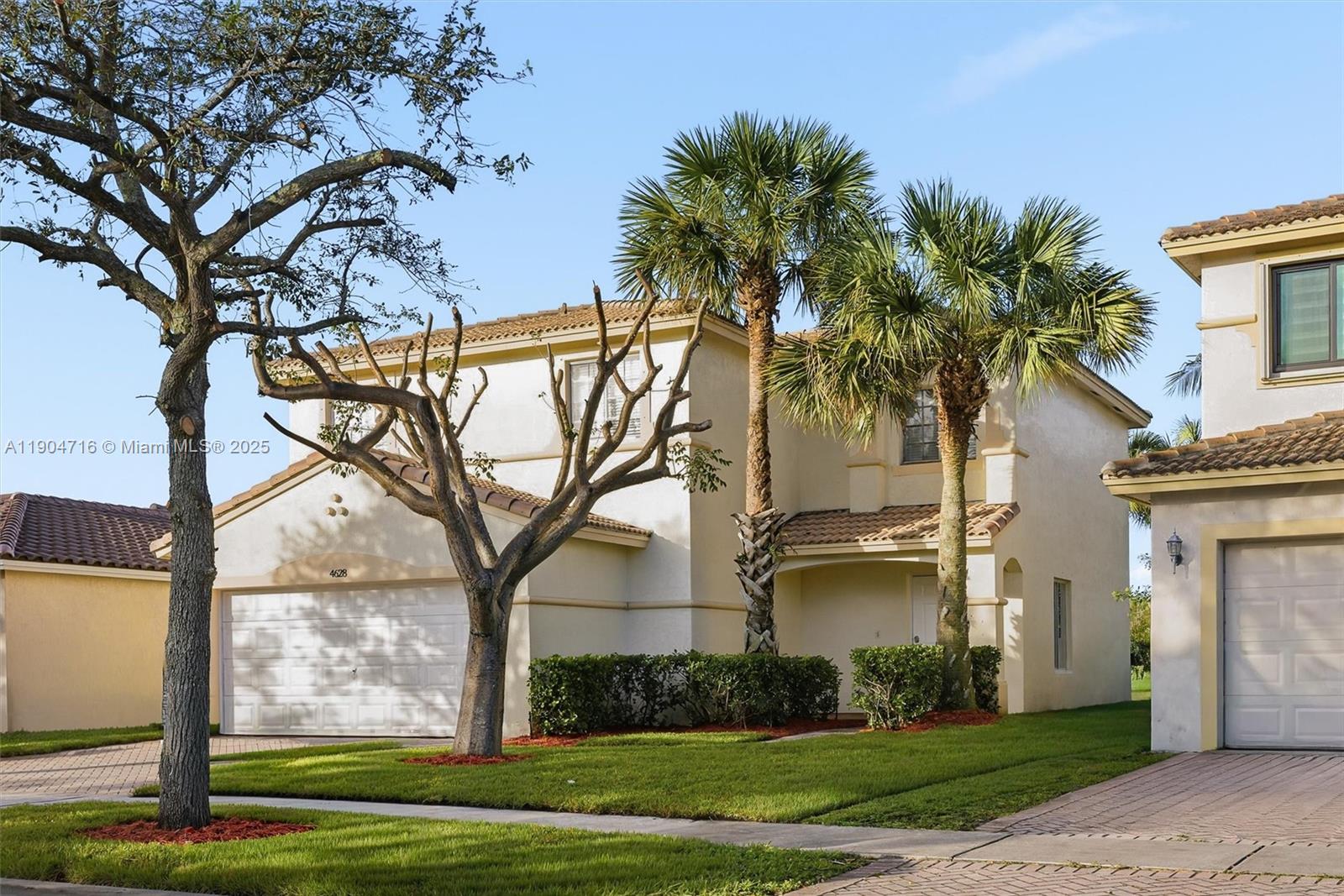 4628 Southwest 125th Lane Miramar, FL 33027 - Photo 2 of 44 a front view of a house with garden