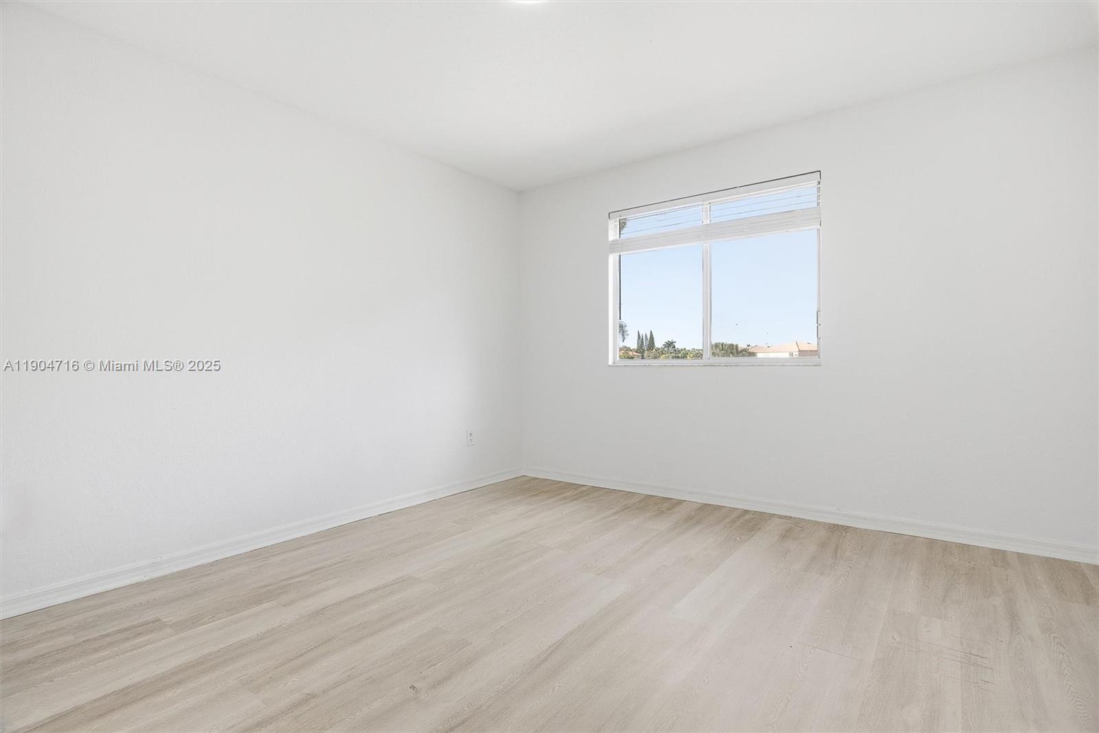 4628 Southwest 125th Lane Miramar, FL 33027 - Photo 21 of 44 an empty room with a window