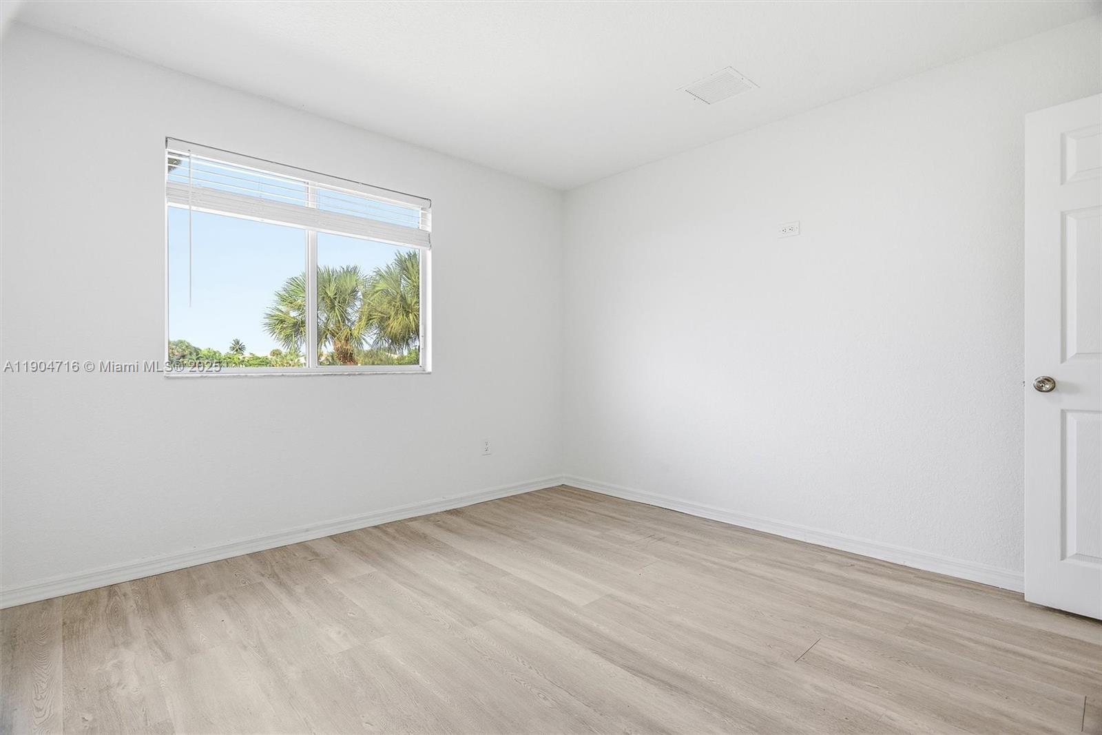 4628 Southwest 125th Lane Miramar, FL 33027 - Photo 22 of 44 an empty room with a window