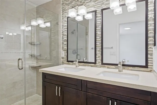 a bathroom with a double vanity sink mirror and double