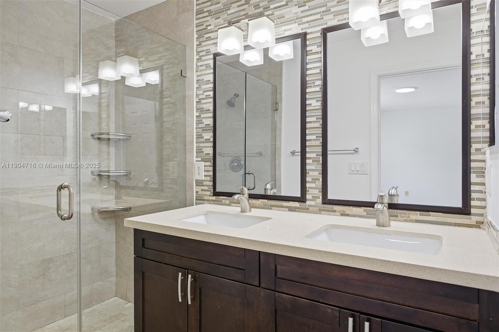 4628 Southwest 125th Lane Miramar, FL 33027 - Photo 25 of 44 a bathroom with a double vanity sink mirror and double