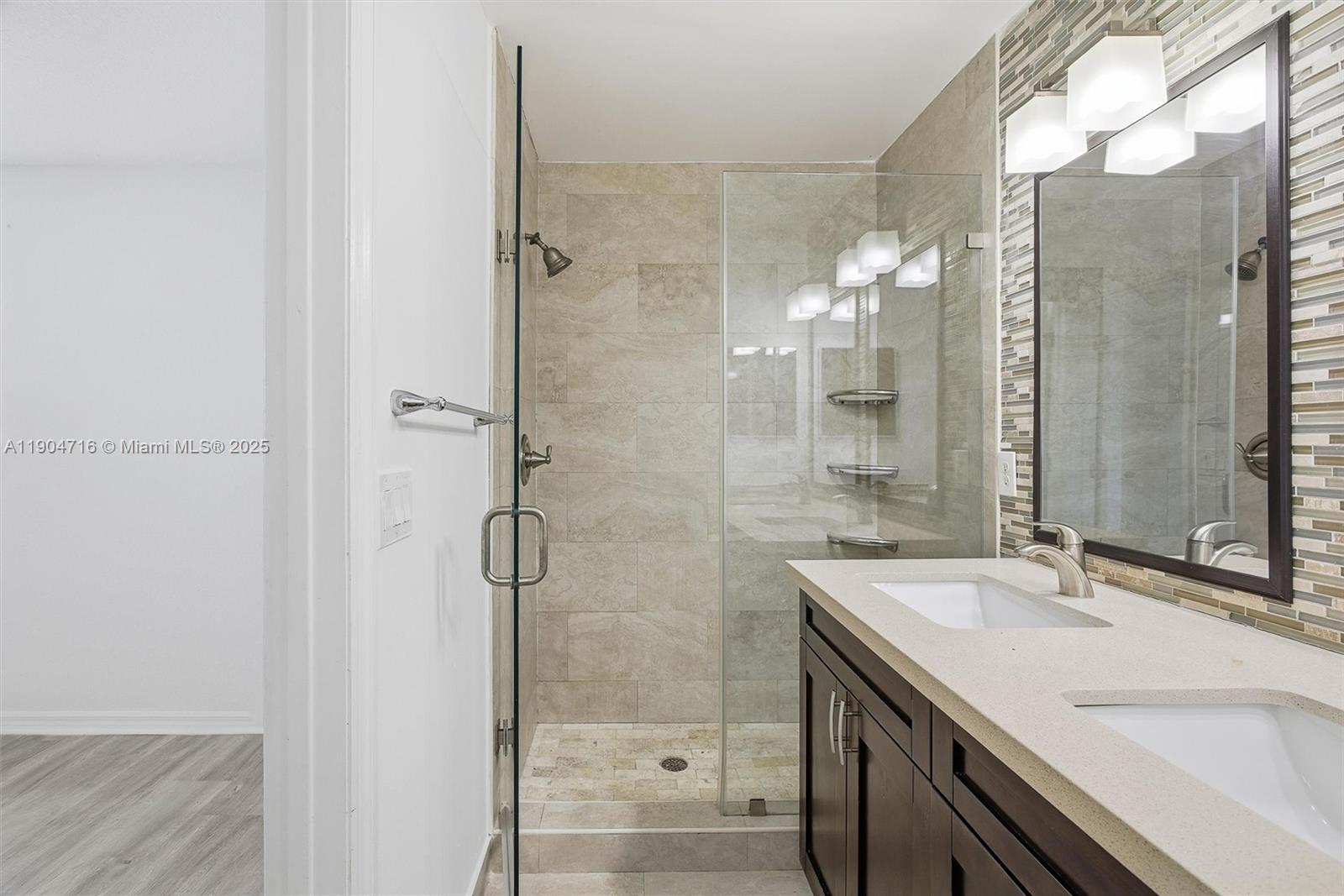 4628 Southwest 125th Lane Miramar, FL 33027 - Photo 26 of 44 a bathroom with a sink and a mirror