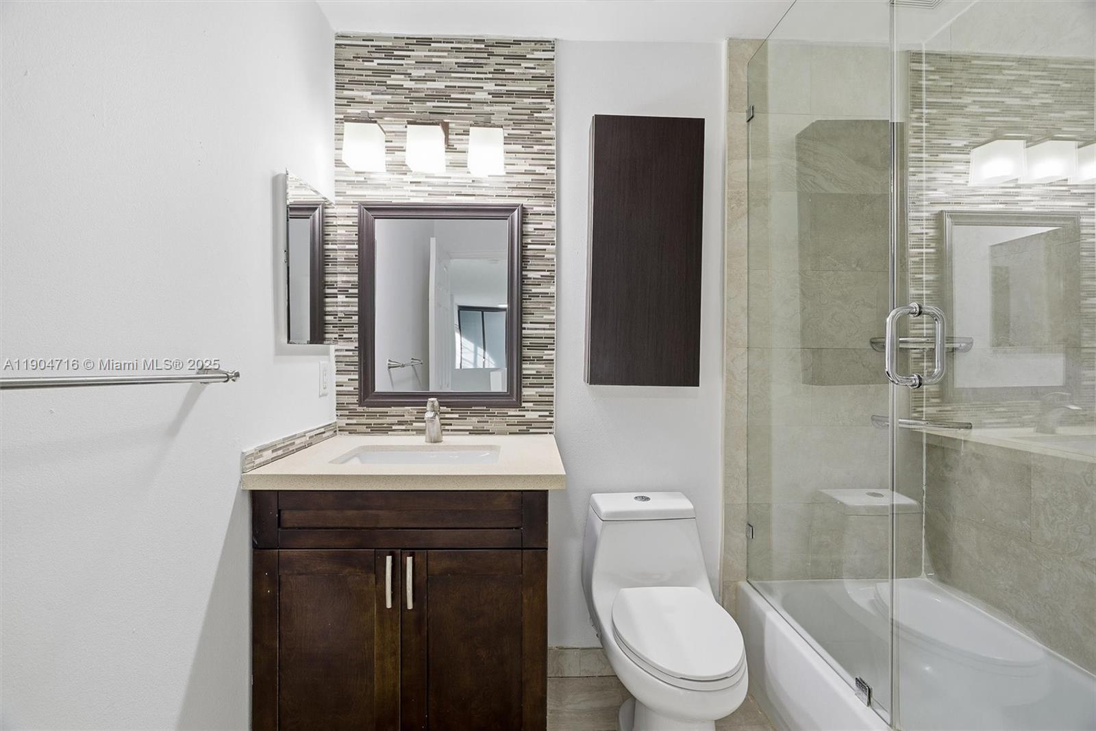 4628 Southwest 125th Lane Miramar, FL 33027 - Photo 33 of 44 a bathroom with a sink a toilet and shower