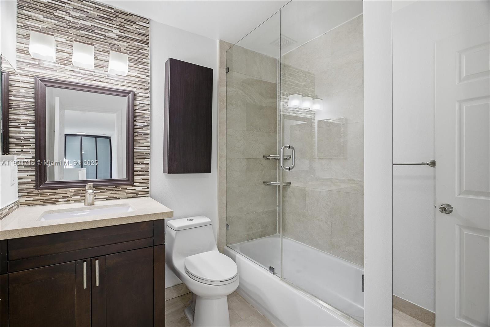 4628 Southwest 125th Lane Miramar, FL 33027 - Photo 34 of 44 a bathroom with a sink toilet and shower