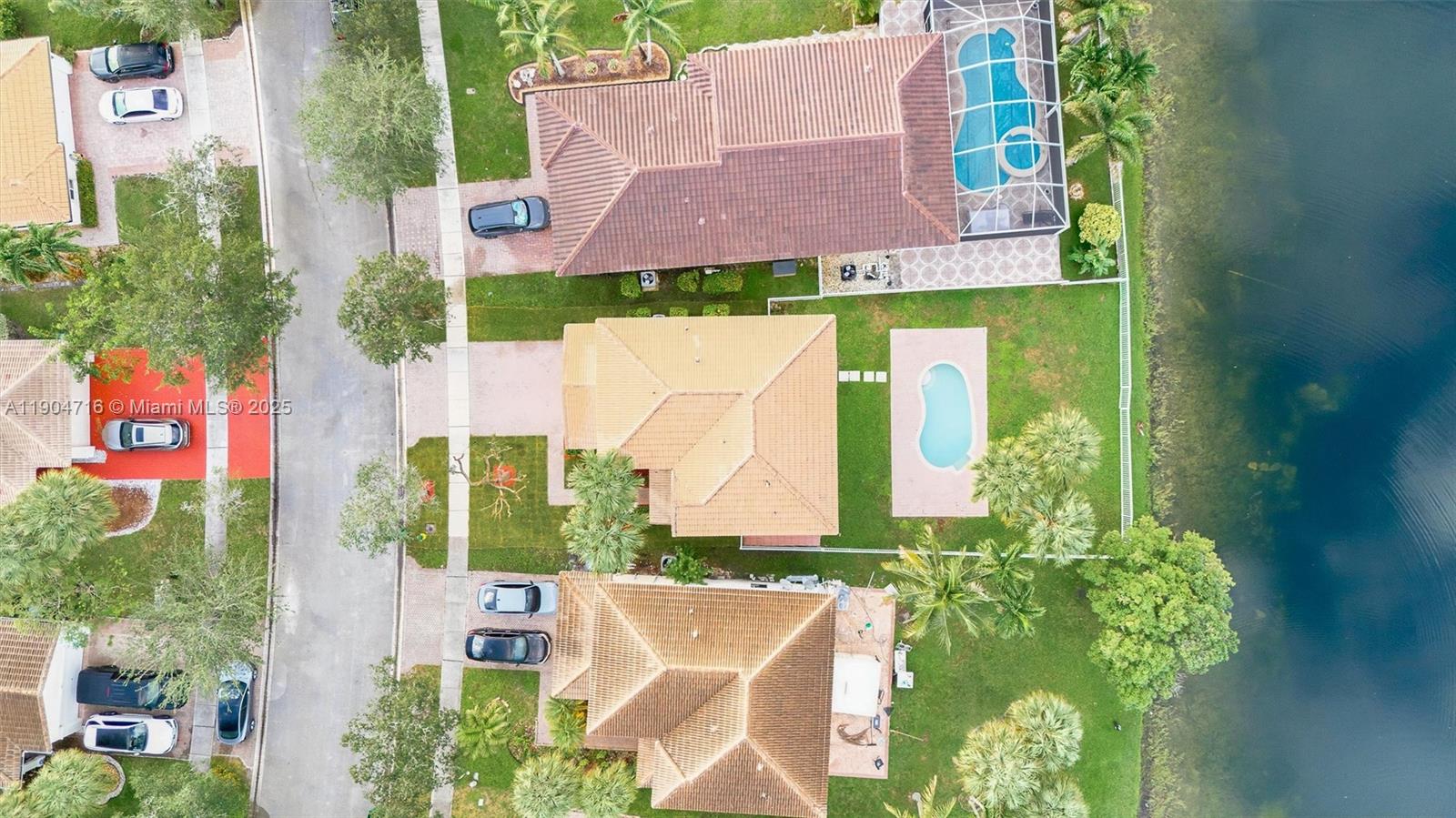 4628 Southwest 125th Lane Miramar, FL 33027 - Photo 4 of 44 an aerial view of house with yard and swimming pool