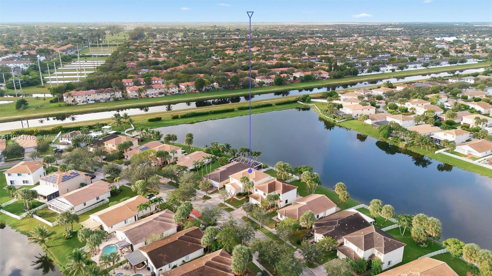 4628 Southwest 125th Lane Miramar, FL 33027 - Photo 42 of 44 an aerial view of residential houses with outdoor space