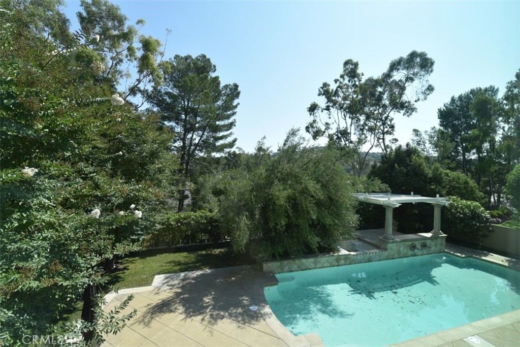 12 Brigadier Irvine, CA 92603 - Photo 34 of 50 a backyard of a house with a garden and deck