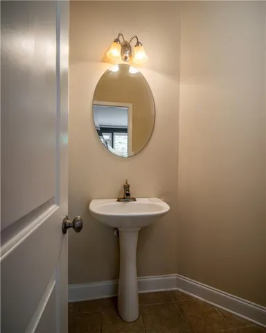 a bathroom with a sink and mirror